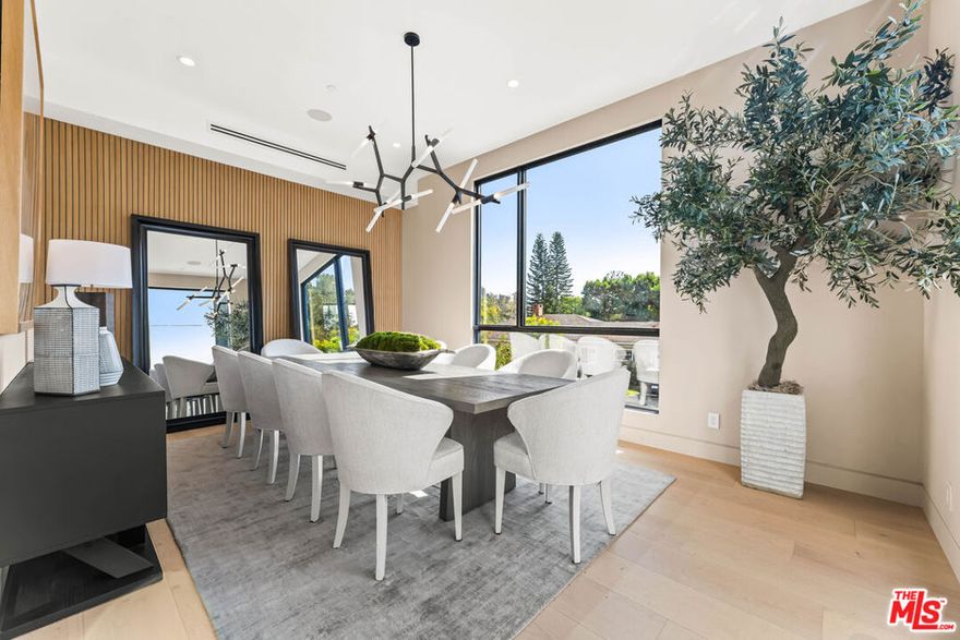 Located in Brentwood, this home blends modern luxury, thoughtful design, and seamless indoor-outdoor living. With over 90ft of frontage this home features 6 bedrooms, 8 bathrooms, gym, home theater with Sony 4K projector, and a large spacious flat backyard perfect for entertainment. Soaring ceilings and abundant natural sunlight throughout. Generous living areas and expansive Fleetwood pocket glass doors provide the perfect setting for entertaining & everyday living. Gourmet chef's kitchen with top-of-the-line appliances, plenty of cabinets, and oversized center island. The spacious master suite offers a serene sitting area, fireplace, and custom walk-in closet designed for refined luxury. This home provides a perfect blend and exquisite fusion of timeless elegance, warmth, and contemporary living.