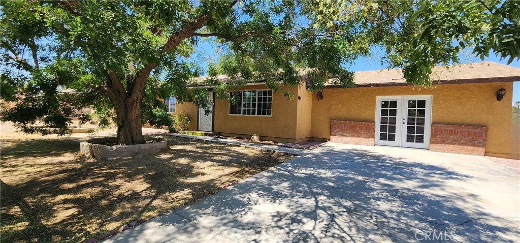 Nice family home located in the city of Palmdale with 40,481 Lot Size, great for family gatherings, plenty of parking space. Great opportunity to buy a home near Lake Los Angeles. This house features a master room with his & hers closet, private bathroom, total of 4 bedrooms, 2 bathrooms, living room with fireplace for those cold nights. New plumbing has been installed. Septic tank. Huge backyard with patio, plenty of parking, R.V. access, nearby Palmdale and 160th Street E. Plenty of space to build an ADU. Washer and dryer hook-ups are installed in the garage.