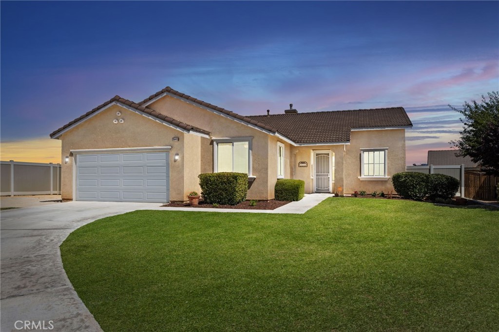 Like New Living on a Huge End of Cul-de-Sac Lot
This immaculate 5-bedroom, 3 bath home offers over 2,000 square feet of comfortable living, including a private guest casita-an uncommon find in the High Desert. Built in 2005 and well maintained, it has been thoughtfully updated and is move-in ready. Sitting at the end of a quiet cul-de-sac in a curb-and-gutter Victorville neighborhood, it offers both curb appeal and a commuter-friendly location.
Inside, the pristine, bright and welcoming interior features fresh paint, neutral oversized tile, and new carpet throughout. The spacious kitchen stands out with brand-new quartz counters, stainless steel oversized culinary sink, new appliances, recessed lighting, pantry, and abundant solid wood cabinetry. A large island with breakfast bar flows into the open-concept family room, complete with inset shelving and a corner fireplace. Display your family photos on the hallway counter with extra storage below.
The main house offers four bedrooms, including a generous master suite with space for a sitting area or workspace, a large walk-in closet, and an updated quartz countertop ensuite bathroom with dual sinks, soaking tub, and separate walk-in shower. Three additional bedrooms provide plenty of room for family or guests.
The attached one-bedroom, with full bath guest casita is the highlight of this property. With nearly 120 square feet of private living space and its own exterior entrance, it’s perfect for in-laws, guests, a college student, or even a dedicated office or workout space.
Out back, the private yard is fully fenced with custom vinyl, includes a drive-through gate and a gated dog run, and is ready for your vision of a garden or outdoor entertaining area. Additional features include a fully finished, freshly painted two-car garage with storage, rv parking, over sized lot tile roof, central air, ceiling fans throughout, indoor laundry room with cabinets, plus iron screen doors on both the main home and casita.
This commuter-friendly location is in a lovely neighborhood, is close to Village Elementary, Puesta Del Sol Elementary, and Challenger School of Sports and Fitness, as well as shopping, dining, and multiple commuter routes down the hill.
If you’re looking for a home with space, flexibility, and thoughtful updates, Moccasin Court is ready to welcome you.