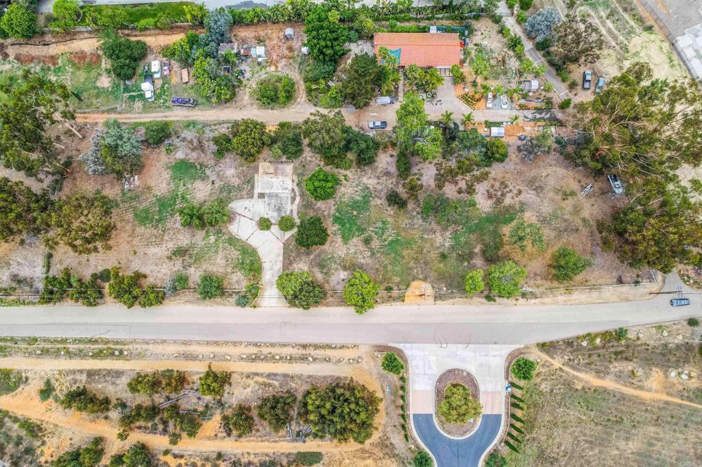 Discover this exceptional 2.65 acer parcel nestled in Rancho Santa Fe's non-covenant area. Set within the tranquil heart of Rancho Santa Fe this parcel is a rare find—offering access to renowned schools, privacy, and incredible potential. This flat, regularly shaped tract of land presents an ideal foundation for a custom estate. Its expansive frontage, coupled with sweeping mountain views, creates endless opportunities for dramatic landscaping and a stately entrance. What distinguishes this property is its unique character: the parcel previously hosted a residence, offering valuable developmental advantages and enhancing its story. Whether you envision a modern sanctuary or a classic design, this secluded site offers a truly one-of-a-kind opportunity to build in one of San Diego County’s most prestigious enclaves.