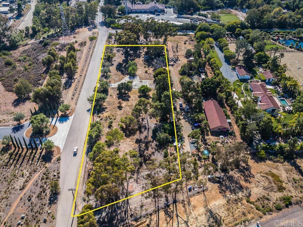 Discover this exceptional 2.65 acre parcel nestled in Rancho Santa Fe's non-covenant area. Set within the tranquil heart of Rancho Santa Fe this parcel is a rare find—offering access to renowned schools, privacy, and incredible potential. This flat, regularly shaped tract of land presents an ideal foundation for a custom estate. Its expansive frontage, coupled with sweeping mountain views, creates endless opportunities for dramatic landscaping and a stately entrance. What distinguishes this property is its unique character: the parcel previously hosted a residence, offering valuable developmental advantages and enhancing its story. Whether you envision a modern sanctuary or a classic design, this secluded site offers a truly one-of-a-kind opportunity to build in one of San Diego County’s most prestigious enclaves.
