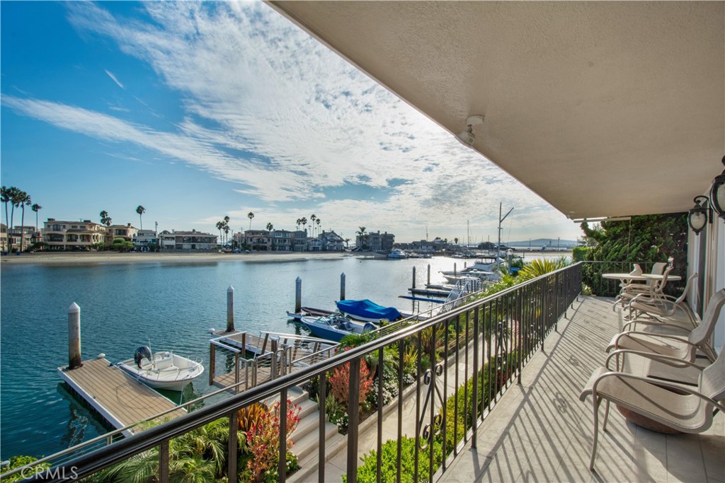 Waterfront Living on Treasure Island | Naples, Long Beach. Tucked away on one of the most coveted stretches of Treasure Island in Naples, this waterfront residence captures the essence of Southern California coastal living. With 3 bedrooms, 3 bathrooms, and a coveted 45-foot-wide lot spanning 1.5 parcels, the home offers a rare combination of scale, charm, and lifestyle. A newly improved dock accommodates multiple boats—whether it’s a yacht, Duffy, or paddleboards—making harbor adventures effortless. The home’s rear patio and garden provide a private, tranquil retreat, ideal for alfresco dining and relaxed entertaining after a day on the water. Inside, sunlit living spaces flow seamlessly to the waterfront, maximizing views and connectivity to the outdoors. All three bedrooms are thoughtfully located upstairs, creating a private retreat from the home’s social spaces.
Just beyond your door, enjoy the vibrant lifestyle of Naples—stroll the canals, dine at waterfront restaurants, or cruise the bay at sunset. This Treasure Island property embodies the very best of Long Beach coastal living, blending modern functionality with timeless charm.