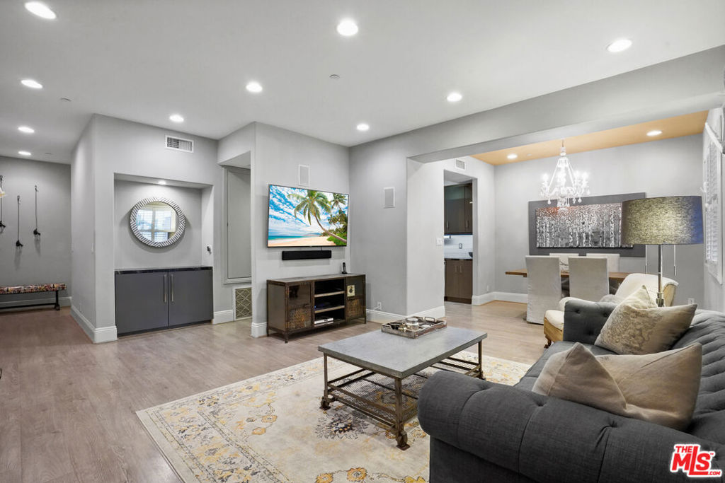 Welcome to this stunning, fully furnished, designer-made condo with high-end finishes, in the community of Pacific Palisades, nestled conveniently between the vibrant energy of Santa Monica and the laid-back charm of Malibu. This spacious 2 bed, 2.5 bath 'designer done' sanctuary, boasts an abundance of natural light and a breezy atmosphere, which epitomizes coastal living. Step inside a carefully curated space adorned with designer furniture, exquisite decor, Nest thermostat, an Alarm you can activate, captivating original artwork and custom finishes that create an ambiance of refined elegance. The heart of this Apt. is a renovated, high-end kitchen, equipped with top-of-the-line appliances, custom cabinetry and a built-in pantry, making meal preparation a delightful experience. The en-suite primary bedroom is light and bright with a fireplace, multiple storage / custom closets, a small office off to one side, plus a built-in desk and a lovely, tiled patio with water feature. The primary bath is a luxurious retreat, featuring a rejuvenating shower, bidet, and a freestanding tub, perfect for unwinding after a long day. Washer Dryer closet in unit. Soft-touch drawers and custom cabinetry throughout ensure effortless organization and functionality. Outside, inviting patios adorned with Italianate tiles offer a serene setting for alfresco dining, morning coffee, or simply soaking in the SoCal sunshine. Whether you're a culinary enthusiast or simply enjoy the finer things in life, this condo is move-in ready, providing everything you need for a comfortable and convenient lifestyle. From crockery and cutlery to appliances, every detail has been meticulously considered to offer the utmost convenience and sophistication. Experience the epitome of coastal luxe living in this inviting custom space. Property is a short distance to world class hiking trails, beautiful beaches, fine dining, high-end shopping, with the bustling streets of Santa Monica and the pristine shores of Malibu just moments away. The Building and Condo have both been extensively remediated and cleaned by a professional hygienist following the Palisades Fire, The Condo has been painted, air filters changed, etc. Please note that following the fires, the Caruso Village is scheduled to re-open in early to mid 2026. Please also note that the living room couch, coffee table and primary suite bed is no longer included in the furnishings. Be part of the re-birth of this incredibly special community. Available for immediate occupancy. Minimum 1 year lease term. No Pets Please. Excellent credit and a FICO score of 750+ required. Please call regarding a pet.