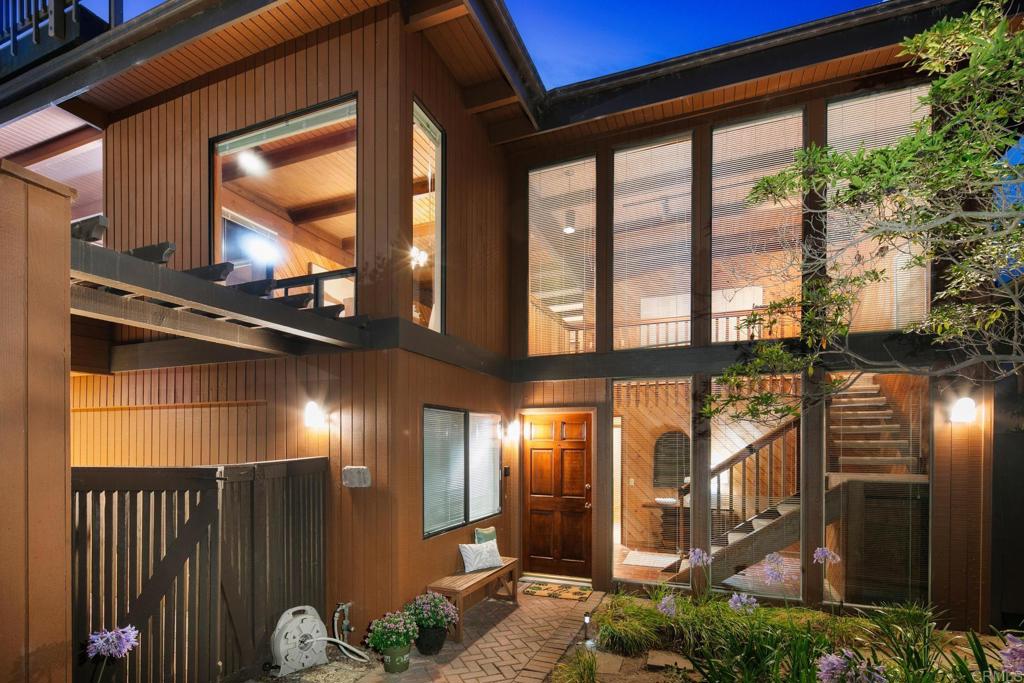 Welcome to this stunning 4-bedroom, 3-bathroom home in a coveted Del Mar neighborhood, offering breathtaking ocean-to-mountain views & timeless mid-century style. With nearly 3,000 square feet of living space, the open floor plan seamlessly connects the central kitchen, spacious living areas & inviting decks—perfect for both everyday living & entertaining. This versatile layout features two primary suites with ensuite baths—one conveniently located off the main living area & the other privately situated downstairs. Additional downstairs bedrooms share a hallway bath. A long driveway leads to the attached two-car garage, offering ample off-street parking, setting the home back for added privacy & tranquility. Head up to the rooftop deck & take in sweeping 360-degree panoramic views—from sunrise to sunset, ocean to mountains. The enclosed front yard patio is ideal for morning coffee, evening gatherings, or cultivating your garden. In the west-facing backyard, two large sheds offer generous storage or convert to a fun playhouse for kids, while adults enjoy effortless indoor-outdoor living. Tucked away on a peaceful cul-de-sac, this home delivers both serenity & convenience. The award-winning Del Mar Heights Elementary School is just around the corner; with the Torrey Pines Reserve Extension & Beachside Del Mar shopping center only blocks away. A short drive to Del Mar Village with its iconic beaches, vibrant dining & boutique shops. Also, an easy reach to UCSD, top biotech, legal firms, financial centers & shopping destinations. Don’t miss this rare opportunity to enjoy panoramic views, flexible living & the best of the coastal lifestyle.