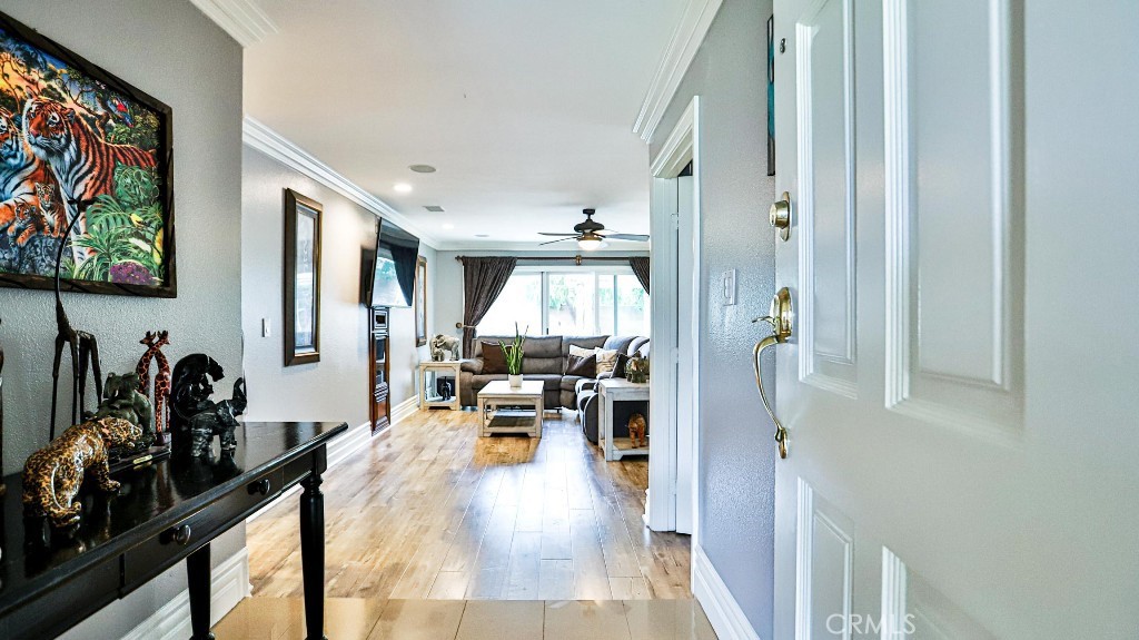 Just listed!!! Welcome to your dream home in the heart of Lake Forest most desirable neighborhoods. This stunning single-story home has modern kitchen with full back splash, quartzite countertops, open concept dinning and living area, ideal for hosting holidays and family gatherings. With four spacious bedrooms, two beautiful full bathrooms with lime stone countertops, crown molding, recessed lighting, baseboards, and laminate flooring throughout the house. Step outside and enjoy a generously sized backyard for outdoor entertaining with patio cover, concrete area and a beautiful built-in BBQ island with bar seating. The home also offers a spacious driveway and a two-car garage. The low monthly HOA of just $124 provides access to Clubhouse, Gym, Ex Room, Spa/Hot tub, Sport Court, Tennis Courts, and several pools, including: Jr. Olympic swimming pool, north pool, a children's wader pool, an adults-only pool, a family/lap pool, a baby pool and a swim lagoon. Easy access to freeways, location attractions, dinning and shopping. Come see this Gem before it's gone!