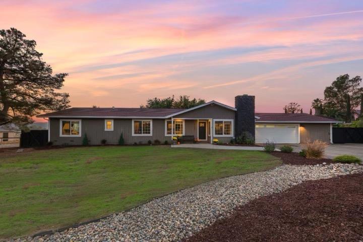WOW! ONE OF A KIND DESIGNER HOME ON 1.14 ACRES! Everything remodeled. This home is a masterpiece where every detail features designer finishes. Gorgeous large chef's kitchen with huge island to seat 10, custom white shaker cabinets, leathered granite counters and butcher block counters, 6 burner gas range, pot filler and coffee corner. Gleaming hardwood-like floors throughout main living areas, huge primary suite with walk-in closet and spa like bathroom. Spacious family room and formal dining room with cozy fireplace. Mud room too! Spacious garage has private hair salon, cabinets and extra storage. More storage in attic with pull down ladder. LIVE on your own homestead with fenced garden and custom chicken coop. Enjoy the evening sunsets on your deck or relax in your hot tub. Large land features horseshoe pit, zip-line, playground, fire pit seating area, garden, chicken coop, shed plus room for whatever else you like. walking distance to 2 wineries, private well, OWNED SOLAR