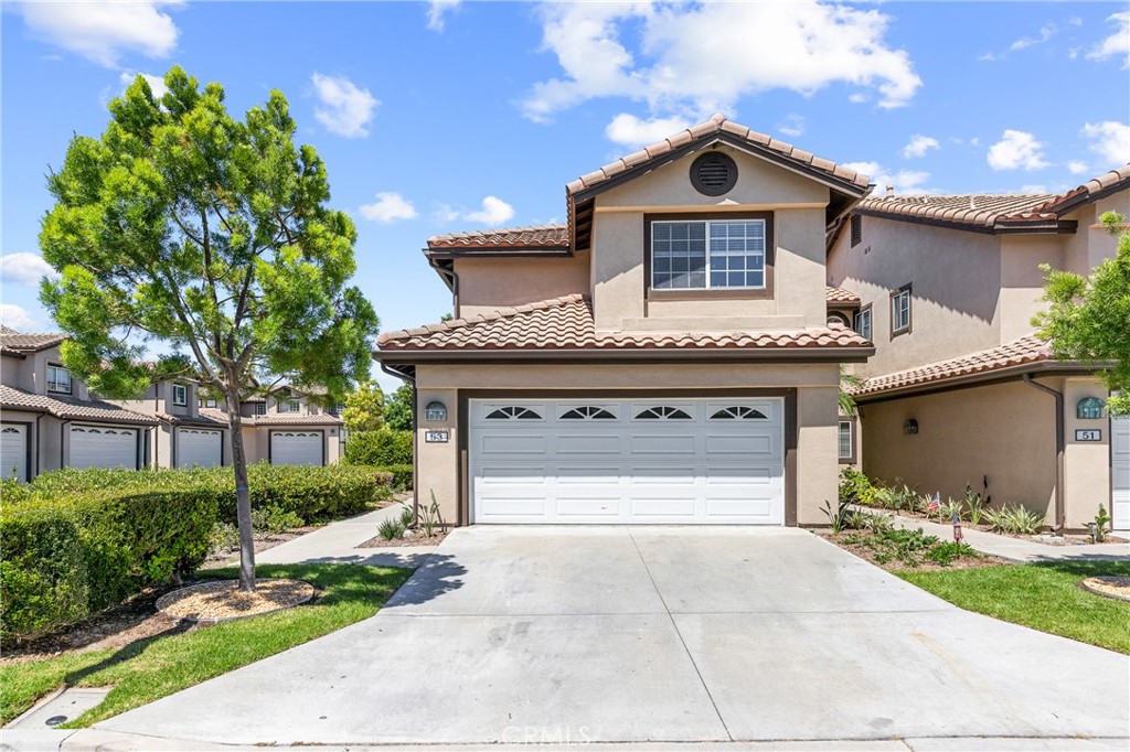 Take in the Marina Ocean cross breeze all summer long, while you thrive in the heart of Aliso Viejo! Priced to sell is this bright and airy end unit nestled in the prized Cantora community! This recently updated 3 bedroom, 2.5 bathroom home is move-in ready with an open floor plan, soaring ceilings and plentiful natural lighting. The home features newly installed premium vinyl flooring in all 3 bedrooms and fresh interior paint throughout the entire home. The kitchen includes a brand-new Samsung refrigerator, Frigidaire dishwasher, recessed lighting, granite countertops and breakfast bar that seamlessly blends into the family room with a perfectly positioned fireplace that adorns the space. The home also features a newer HVAC, copper fitted water heater, and newer washer/dryer. As you enter the home you’re greeted with an expansive space combining both the dining area and living room. The main floor living areas are open, warm and welcoming, perfect for hosting all your family gatherings. To the side of the family room sliding doors take you to your private enclosed backyard patio with brick planters, drought resistant plants and fertile irrigated soil. The staircase with illuminated step lighting transports you to the serenity of the spacious master suite with sizable closet, dual vanities, and walk-in shower. The generously sized secondary bedrooms are just adjacent to the hallway’s full bathroom. The attached two car garage provides direct access to the home and guest half bathroom upon entering. The garage is fitted with an abundant amount of storage, cabinetry along the wall and ceiling mounted racks. Cantora community amenities offer a resort style pool and clubhouse, wider streets and plenty of parking spaces. Close proximity to highly rated schools, Aliso Viejo Town Center, Woodfield Park, entertainment, dining, shopping, hiking, the 73 toll road and so much more!