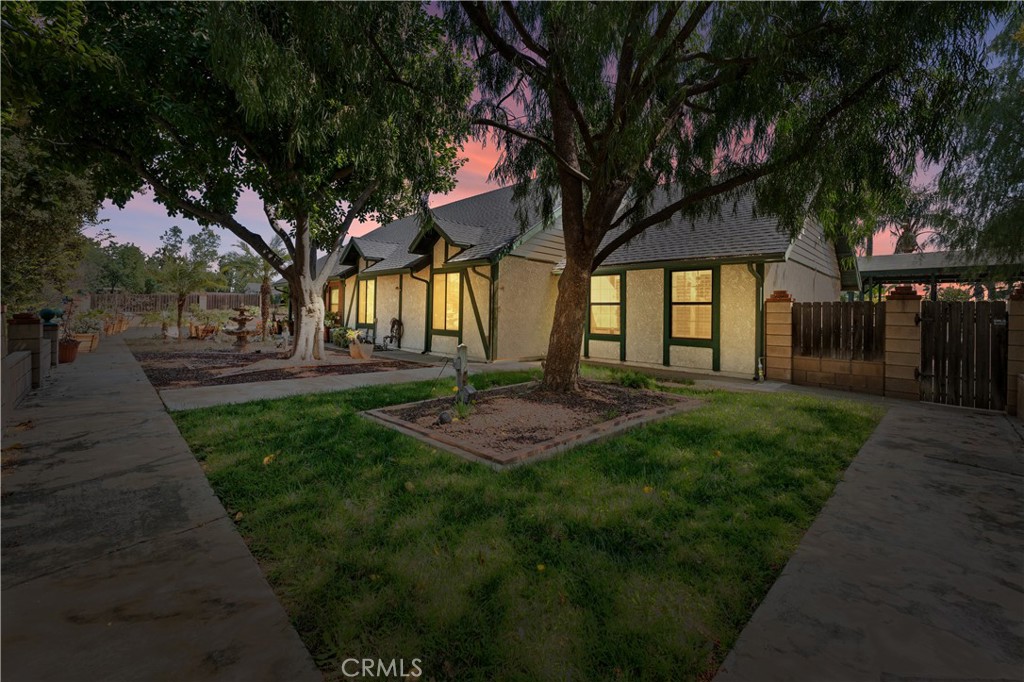 Nestled in a serene location, this stunning home offers the perfect blend of privacy and convenience. With a long, winding driveway that leads you to the front door, you'll immediately feel the sense of peace and seclusion, while still being just moments away from shopping and dining options in the area. A true hidden gem! The front porch boasts breathtaking views of the surrounding mountains, allowing you to start and end each day in tranquility. Surrounded by mature trees and lush greenery, this property is truly an oasis, providing the perfect escape from the hustle and bustle of everyday life. With a large front lot that has endless possibilities for a future ADU. Not to mention a large pool and spa to enjoy those long summer days relaxing in the water, by your spacious cabana. Perfect for hosting parties. Inside, the home exudes charm and character, with gorgeous, exposed wood beams in the living room that add a rustic yet elegant touch. The spacious family room is centered around a cozy fireplace, perfect for relaxing evenings, and features a custom built-in TV cabinet for a clean, streamlined look. For those who love to entertain, the built-in bar is every host or hostess's dream, providing an ideal space to gather with family and friends. With plenty of room for hosting this entertainment house also has a spacious formal sitting (or second living room), and dining room. The dining room is equally impressive, featuring built-in shelves that offer both style and function, providing plenty of space for your books, decor, or collectibles. Gorgeous solid wood features are found throughout the home, enhancing the natural beauty and warmth of each room. This home offers three generously sized bedrooms, each offering ample closet space. One of the bedrooms even features a built-in desk and a Murphy bed, perfect for guests, an office, or a multi-purpose space. The large master suite is a true retreat, offering plenty of space and privacy. Indulge in ultimate relaxation with a soaking tub, the perfect way to unwind after a long day. This home is truly one-of-a-kind. Whether you're looking for a peaceful sanctuary to call your own or a stylish space to entertain, this property has it all. Don’t miss your chance to make this oasis your new home. Schedule a tour today!
