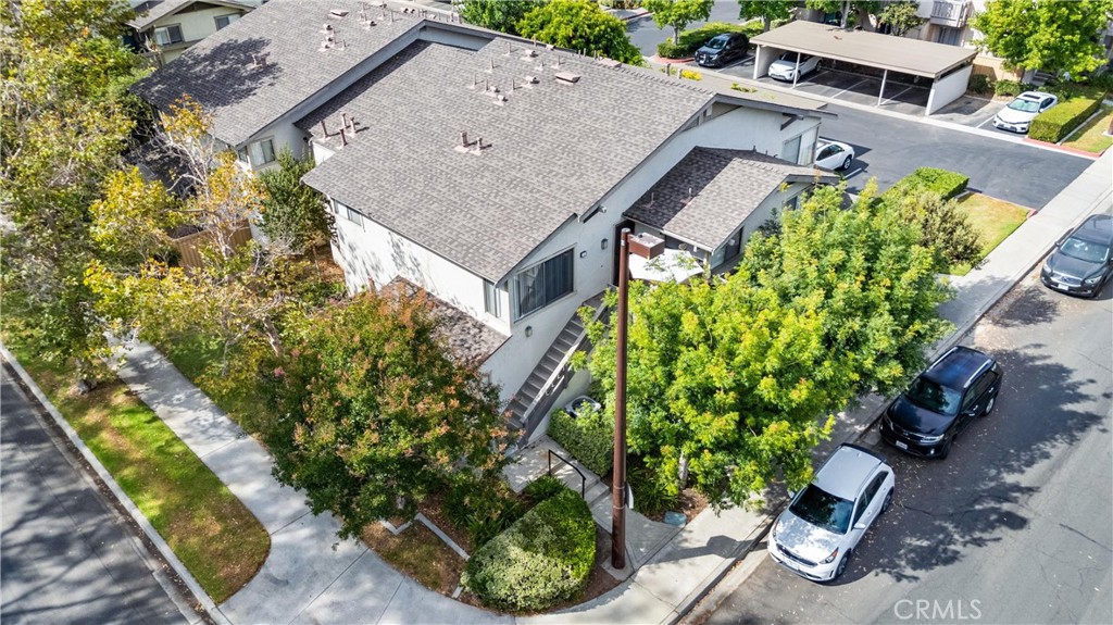 Nestled in the trees, this 2-bedroom, 2-bath single-level upper unit offers 917 square feet of comfortable living with a unique sense of privacy. As an end unit, it enjoys open outlooks and does not face directly into other homes. A charming front patio welcomes you before stepping inside. Its premium setting inside the loop places it away from busy streets and the highway, directly across from a community park and pool. South Lake and the South Lake Beach Club are just a short distance away and part of the everyday rhythm of life here. Living in Woodbridge means enjoying resort-style amenities, including two lakes, multiple pools, tennis and pickleball courts, and miles of walking paths. With its tranquil location and easy access to all that Woodbridge has to offer, this residence captures a sought-after Irvine lifestyle in a manageable and inviting space.