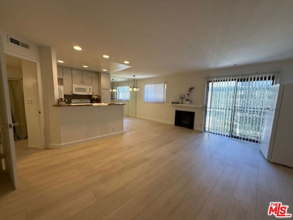 Great townhouse apartment with new laminate floors throughout. Wonderful closet space. Enter on first level to Living & dining area off the open kitchen. Kitchen has granite countertops with stove, dishwasher, microwave and refrigerator. Faux fireplace in living room area. Downstairs full bathroom with granite counter top and tile flooring. NO Balcony. Upstairs has 2 suites- One is larger than the other, but each has its own bathroom. Primary suite has 2 closets with mirrored doors. Loads of natural light. Community laundry room. Parking in garage- one space that fits 2 cars tandem No smoking unit/building. One pet/unit under 35 pounds-Non-aggressive breed. Close to 101 & 405 freeway. Close to Sherman Oaks Fashion Square and Sherman Oaks Galleria. Close to New Trader Joes, Ralphs and Whole Foods. Loads of yummy cafes and boutiques near on Ventura Blvd. Please contact Michelle Hanna for showing 213.923.8086