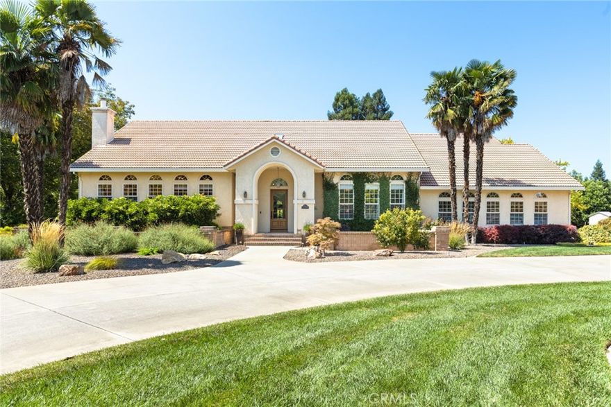 Mediterranean Estate on 2.5 Acres with Guest House, Pool and Owned Solar.  3515 BELL ESTATES  DRIVE - 5000 Sq Ft. Main Residence + 1000 Sq Ft. Detached Unit.  Welcome to Bell Estates Drive, a true private retreat nestled on 2.5 acres of beautifully landscaped grounds.  This impressive 5,000 Sq Ft Mediterranean-style home features 5 bedrooms, 4.5 baths and timeless architectural details -including gorgeous beamed ceilings and spacious living throughout and a 3 car garage.  The main level offers a grand entry into an an expansive living room, a stunning formal dining area and a chef's kitchen complete with granite countertops, new appliances, a massive 63X53 island with built-in storage, a 6-burner gas stove with griddle station, and bonus refrigerator nook off the hall. Also on this level of the home:  a spacious eat-in kitchen area, a guest bedroom with adjoining full bath, large laundry room and a convenient half bath near the entrance.  Upstairs, discover a serene music room with an attached library, a private office (easily used as a 6th bedroom), and a luxurious master suite featuring a cozy sitting area with backyard views. The master bath is a spa-like sanctuary with dual vanities and a jacuzzi tub.  The lower level offers incredible flexibility with 3 additional bedrooms, 2 full bathrooms, its own large living area, and a second laundry-perfect  for multigenerational living or extended guests.  A standout feature is the 1,000 Sq Ft. detached unit, complete with 1 bedroom, 1 bath, living room plus spacious game area, a 9X9 chilled wine room and a private patio that opens directly to the sparkling 20X40 sparking pool.  The detached unit is currently a successful Airbnb rental providing an excellent income opportunity. The property also has a large storage/shop perfect for your toys.