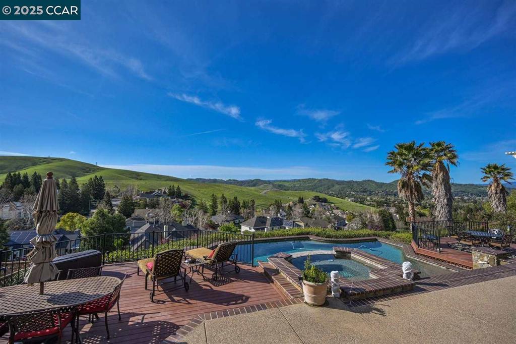 STUNNING PANORAMIC VIEWS!!! OPEN SUNDAY 1-4PM. This FABULOUS Rancho Paraiso Harold Smith built home with pool is located on one of the BEST VIEW LOTS with ABSOLUTELY INCREDIBLE PANORAMIC VIEWS OF THE VALLEY... Features include a dramatic entry with two story ceilings, impressive family room with fireplace, huge windows, patio door and spectacular views of the Valley, gourmet eat-in kitchen with top of the line appliances, patio doors, pantry and views forever, elegant living and dining rooms with large windows and fireplace, 1st floor primary suite with fireplace, patio doors, stunning panoramic views and luxurious primary bath, 5th bedroom or office on main level with nearby full guest bath, 3 large bedrooms, full bath plus exercise room or 2nd office space upstairs, and an entertainer’s dream backyard with pool, spa, outdoor kitchen, bar, lawn, incredible panoramic sunset views of the entire Valley and so much more!!! Excellent Northgate Schools, close proximity to Arbolado Park, Shadowbrook Winery, Mt. Diablo, Local Trails, Boundary Oaks Golf, Whole Foods & Orchard Shopping Centers.