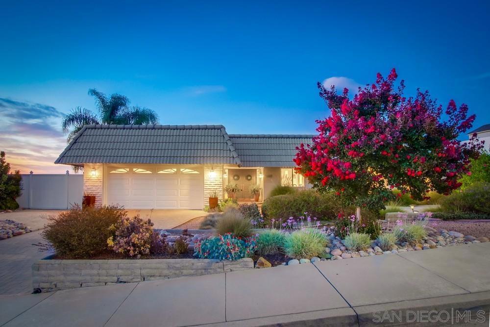 It's not just a home, it's Fletcher Hills finest! Pristine elegance awaits you! Highly sought-after 1 level home on a 15,000 sq.ft breathtaking view lot! No detail missed and incredible pride-in ownership envelopes this property the minute you arrive. Beautiful brick driveway and lush flowering landscape greets you! Stunning formal entry with dual front doors with beveled glass side frames! Huge living room with oversized windows allowing for amazing city light and mountain/hills views plus cozy fireplace for cooler evenings! Living room flows into the open concept gourmet kitchen! Fabulous stone counters, stainless refrigerator, loads of cabinet and counter space, breakfast area, and breakfast bar seating for your more casual meals! Formal and elegant dining room with stunning china cabinet and hutch! Large luxury primary suite with French doors out to pool and patio, en-suite bath with dual sinks, and big walk-in closet! Nice sized additional bedrooms-1 could make an ideal office too! Lush green view backyard with covered patio, sparkling pool, gazebo, and plenty of room to entertain, kid play, and pets! Details not to miss-inside laundry room, top-of-the-line engineered wood flooring in most of the house, 2 car garage, owned solar, central heating and air+! Make this YOUR home before someone else does! Welcome Home!