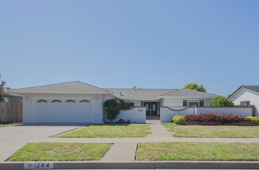 Welcome to this beautifully maintained home in Monterey Park, recently refreshed with new interior & exterior paint, updated carpeting & various thoughtful improvements. Spanning 2,023 sq ft, the home features a spacious layout with large rooms, vaulted ceilings & open floor plan that connects the family room, dining area & kitchen. The layout allows for a more formal dining experience by swapping the family & dining areas to suit your needs. The living room includes a wood-burning fireplace & beamed ceilings, while four sets of sliding glass doors fill the space with natural light & fresh air. The primary retreat offers generous closet space & an en-suite bathroom, providing a private, comfortable escape. Two more bedrooms, a full bathroom & ample closet space throughout complete the interior. The attached two-car garage is also oversized, featuring a laundry area & built-in shelving. Outside, enjoy the peaceful front courtyard & a beautifully paved backyard patio perfect for outdoor dining & entertaining. Enjoy the fruit trees, which include a lemon & pear tree that produce delicious fruit. Conveniently located near shopping, medical facilities, schools, parks & the scenic Monterey Peninsula, this home blends comfort, flexibility, and location to suit a variety of lifestyles.
