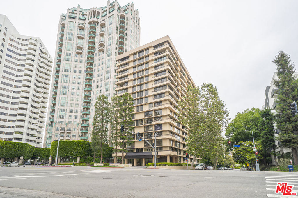 Experience the sophistication of this elegant Northwest corner unit on the 14th floor, which offers breathtaking panoramic views. Located in the desirable Wilshire Corridor, this residence features an open floor plan that harmoniously connects the living and dining areas, complete with a fireplace, wet bar, and a balcony. The unit comprises two bedrooms plus a den, currently serving as a third bedroom, and three bathrooms, showcasing stunning vistas that stretch from the Hollywood Hills to the Pacific Ocean. Natural light pours in through expansive windows, enhancing the dramatic dining space and inviting living areas. The thoughtfully designed layout includes spacious bedrooms, each with access to a private balcony and en-suite baths. The primary suite is a highlight, featuring dual walk-in closets and a luxurious bathroom with a double vanity and a separate step-in shower. Ideally located just minutes from Westwood Village, UCLA, and Westfield Century City, with convenient access to the 405 freeway, this residence presents a unique opportunity to create a personalized home in a prestigious high-rise, complemented by full-service amenities such as 24-hour concierge, valet parking, a pool, gym, and a rooftop deck.