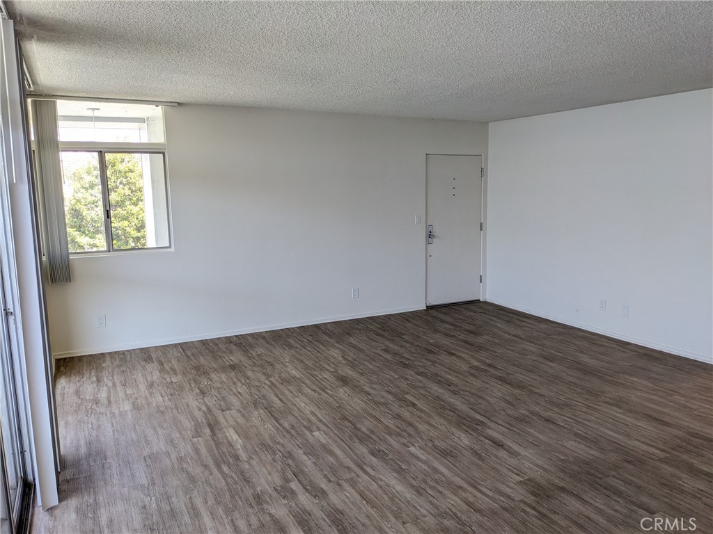 Welcome to this beautiful and stylish upper level 2-bedroom/ 2 bathroom apartment in the highly desirable area of Brentwood! The apartment is bathed in lots of natural sunlight and the living room comes equipped with a relaxing balcony. Wood flooring throughout. Black quartz counters and wood cabinets in the kitchen and bathroom. Appliances included: refrigerator, electric range, dishwasher, and built-in A/C unit. There is also an on-site shared laundry room. Includes 1 on-site parking space. Landlords pay for trash; tenants pay for all other utilities. Non-smoking property. Small pets are allowed; service animals are welcome!