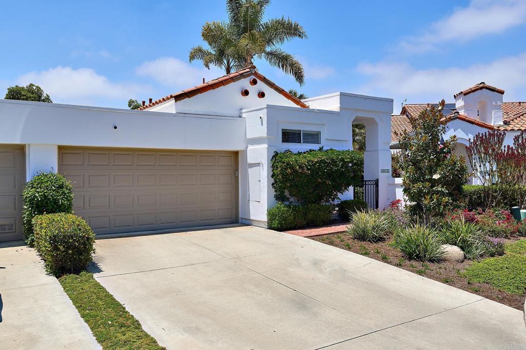 Perched on the View side of this Highly Coveted Location with Celestial Breezes and Distant Ocean View! This intimate Cul De Sac Street with surrounding Greenbelt is lined with towering, mature Trees and lovely Foliage! This Ever Popular, Single Story St. Tropez model (1,800 sq. ft) oozes with potential to personalize and make it your own private Sanctuary. Dramatic Entry opens to Vaulted ceilings and Beautiful Wood Center Beam! The Open Concept combines the Living room and Formal Dining Area! The Kitchen boasts newer Granite Tops and a Cozy breakfast Nook. The attached Atrium offers Abundant, Natural Light, that flows throughout! The Master/Primary Suite is oversized with plenty of room for your California King and offers High Ceilings and a rustic wood beam! The walk-in closet is adjacent to the Dual Vanities! The 2nd bedroom is great for guests or as an office, and the Bonus Den area is Ideal for Lounging! The Elevated, rear Patio will be your go to retreat with soothing breezes and Calming views! Perfect for Summer nights! All this and Much More in the Iconic 55+, Resort Style Community of Ocean Hills Country Club! Enjoy Golf, Pickleball, Bocce Ball, Swimming, Walking, Fitness Center, Billiards, Tennis, Dancing, concerts and many other Events and activities right out your front door!