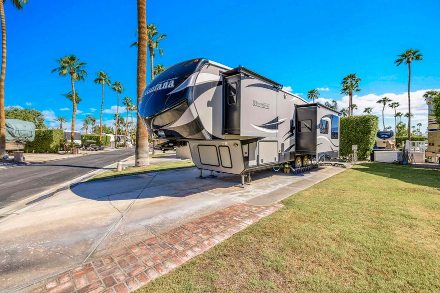 What's great about this lot? Its a terrific corner lot located across from the pool and spa. Capture gorgeous San Jacinto mountain views from the lot and also from interior of rv.  Easy carefree low maintenance lot. Laundry and full restroom facilities also just steps away. Located adjacent to a greenbelt so no neighbor directly to the right. Private location and such a great price for the location and a corner lot.