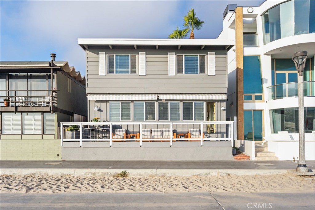 Welcome to the beachfront cottage of your dreams. This South Manhattan Beach Strand home is available fully furnished for lease, offering the ultimate South Bay beach lifestyle. With unobstructed ocean views and direct beach access, you’ll enjoy front-row sunsets every evening.
This beautifully maintained residence features 3 spacious bedrooms and 2.5 bathrooms within an open, light-filled floor plan designed to highlight the coastal setting. The main living area boasts expansive windows overlooking the sand and surf, a cozy fireplace, and seamless indoor-outdoor flow to the oceanfront patio—perfect for relaxing or entertaining. An elevated dining room enhances every meal with sweeping ocean vistas.
The modern kitchen includes stainless steel appliances, generous storage, and a charming built-in breakfast nook. Upstairs, the primary suite offers panoramic views, a fireplace, and a spa-inspired bathroom. Two additional bedrooms on the main level provide comfort and flexibility for family, guests, or a home office. A private courtyard creates an additional outdoor retreat for dining or lounging.
Additional highlights include hardwood floors, in-unit laundry, a two-car garage, and a prime location just five blocks from the dining, shopping, and nightlife of downtown Manhattan Beach.