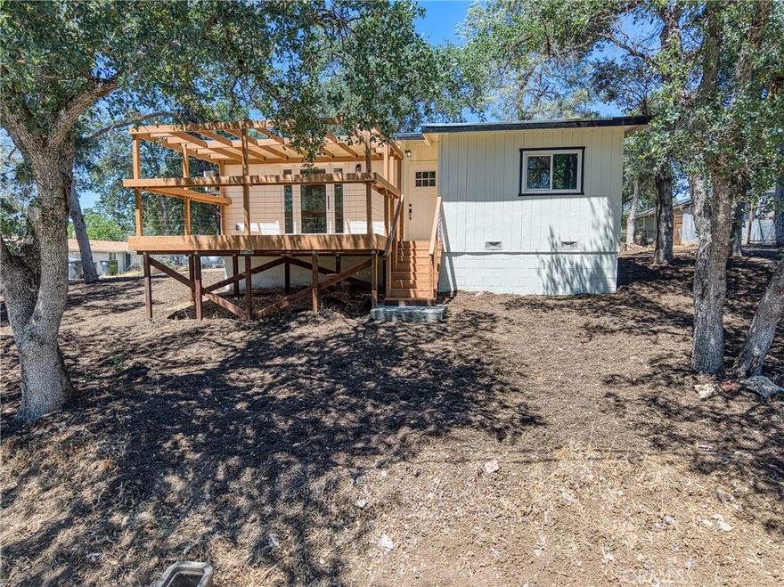 Welcome to this charming 2-bedroom, 1-bathroom home located at 15688 37th Ave in Clearlake. This 800-square-foot house has been beautifully remodeled and sits on a large lot, offering plenty of space for outdoor activities and relaxation.



Inside, you'll find a modern kitchen featuring a waterfall island, abundant cabinetry, and new appliances that make cooking a pleasure, and a new roof. The home includes a new water heater and double-pane windows for energy efficiency. Throughout the house, stylish vinyl plank flooring creates a clean, contemporary look that's easy to maintain.



Step outside to enjoy the new large front deck, complete with a pergola, perfect for morning coffee or evening gatherings. The spacious lot provides room to roam, while the convenient carport keeps your vehicle protected from the elements.



The location puts you close to everything you need. Foods Etc grocery store is just a short distance away for your daily shopping needs. Families will appreciate the nearby Clearlake  Schools, and Redbud Park offers an excellent spot for outdoor recreation and family fun.



This property combines comfortable living with practical amenities in a peaceful Clearlake setting. The recent updates mean you can move in and start enjoying your new home right away. The generous lot size gives you room to garden, entertain, or enjoy the California sunshine. Whether you're looking for your first home or downsizing, this well-maintained property offers the perfect blend of comfort and convenience in a desirable neighborhood.