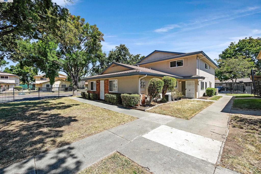 This well-maintained 2-story condo in a well-kept 4-unit building offers 2 bedrooms, 1 bath, and 903 sq ft of comfortable living space with laminate flooring throughout (except for tile in kitchen/bath). The unit includes an attached 1-car garage and access to on-site coin laundry, with the added convenience of being steps from the community pool. HOA fees cover water/sewer, hot water, trash removal, security patrol, and amenities including the clubhouse, pool, and greenbelt. Conveniently located near Highway 4, BART, shopping centers, and parks, this move-in ready condo presents excellent value in Antioch.