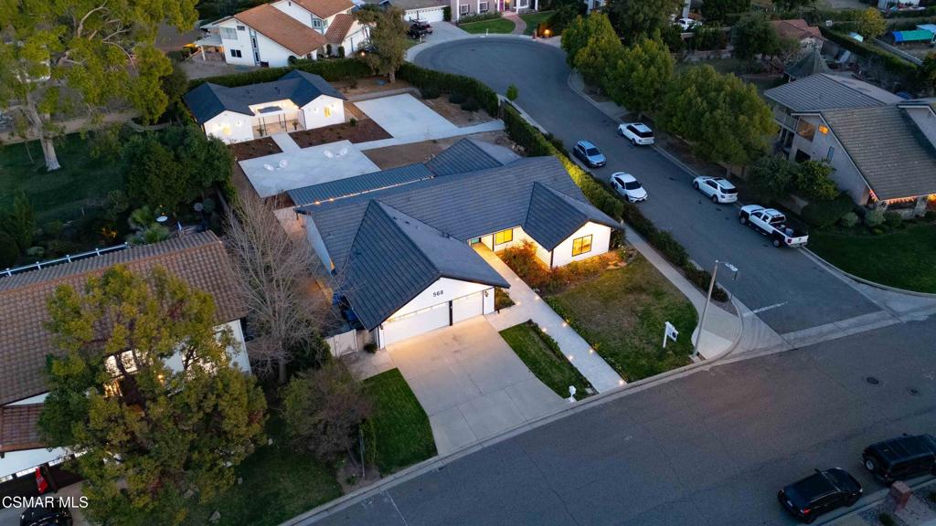 Luxury Meets Lifestyle in this One-of-a-Kind West Simi Valley Property! Single Story with 1,200 sqft ADU!! Don't miss your chance to own a truly exceptional property in the heart of the highly sought-after Pheasant Hills neighborhood of West Simi Valley. This horse-zoned, half-acre corner lot offers a blend of luxury, space, privacy, and flexibility--perfectly suited for multi-generational living, entertaining, and enjoying the very best of California living. This custom single-story home has been thoughtfully remodeled to create a warm and elegant space. The main residence spans 2,765 square feet and features four bedrooms and two and a half baths. Inside, soaring wood beamed ceilings and expansive new windows bathe the interior in natural light, while brand-new luxury vinyl waterproof flooring flows throughout the home, combining beauty with durability. The chef's kitchen is a true showpiece, centered around an oversized quartz island and featuring sleek finishes, a generous pantry with pull-out drawers, and high-end appliances--perfect for both everyday living and entertaining on a grand scale. The bathrooms have been completely reimagined with spa-inspired finishes, oversized walk-in showers, and high-end fixtures, creating a sense of luxury and relaxation in every detail. Solid wood doors, recessed lighting throughout, and a brand-new Lennox HVAC system ensure comfort and quality at every turn. Adding tremendous value and versatility is a beautifully constructed 1,200-square-foot ADU, completed in 2023. Meticulously designed by renowned architect Immanuel Davis and brought to life by the expert craftsmanship of VOSS Construction. With its own private entrance, this detached unit is ideal for extended family, guests, or rental income. It features a full kitchen with stainless steel appliances, its own laundry room, a stylish half bath for visitors, a spacious bedroom, and a luxurious full en-suite bathroom. Designed with both function and comfort in mind, the ADU seamlessly blends with the property while offering complete privacy and independence. Step outside and let your imagination run wild. The expansive backyard is a dream come true, offering endless potential for a barn, a pool, a putting green--or any vision you have in mind. A 40-foot covered metal pergola with pull-down shades creates the perfect setting for outdoor dining or relaxing in the shade, while a sport-court-sized concrete pad provides the ideal space for tennis, basketball, volleyball, or recreational fun. For those with toys or trailers, the property includes a separate gated entrance offering massive RV access with enough room to accommodate multiple RVs, boats, or horse trailers--an incredibly rare feature in this area. The landscaping has been thoughtfully planned with automatic lighting, a full sprinkler and drip irrigation system, and a stamped concrete walkway leading to the front door. Even the garage has been upgraded with insulation, epoxy floor and recessed lighting, reflecting the attention to detail found throughout the home. Opportunities like this don't come often. Come experience it for yourself--and make this exceptional estate your forever home.