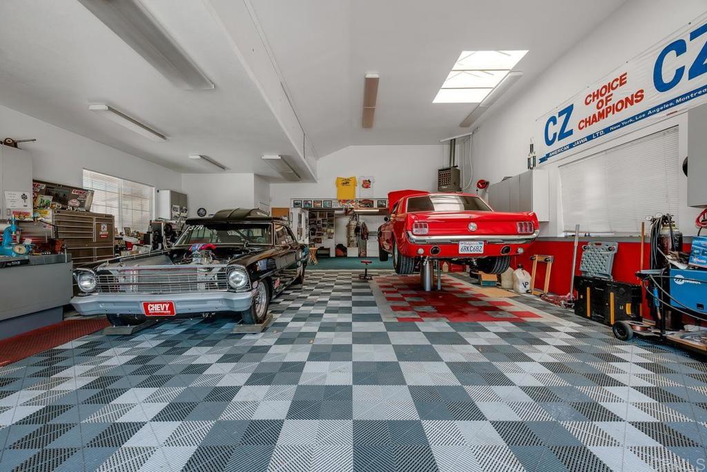 Are you a Car enthusiast, collect them, love to work on them? Well, here is the rare opportunity to own a garage of your dreams, space for 6 cars, a car lift to allow you to work on your vehicle, including a generous workspace with built-in cabinets, overhead storage, and a half bath with utility sink. Located in the beautiful Fire Mountain area of Oceanside, this lovely 3 Bedroom, 2 Bath home, on a 12,647 square foot lot, with a pool, and RV parking. Loving updated over the years with wood flooring, full kitchen remodel, includes granite counter tops, stainless steel appliances, spacious pantry and large eat in kitchen space. A large sunroom space was added from the kitchen. Both bathrooms have been updated with newer cabinets, granite counter tops, and tubs with tile surrounds. Your new primary bedroom offers a spacious closet with mirrored closet doors. Relax by the pool in this low maintenance back yard or set in the shade under the covered patio. You will have plenty of room for the storage of all your pool toys, surfboards, or e-bikes in the spacious shed. Located just 1 mile to Oceanside beaches and easy access to I-5 or Hwy 78. You will be close to all the new restaurants, farmers markets, and City of Oceanside community events. All of this and Ocean breezes!