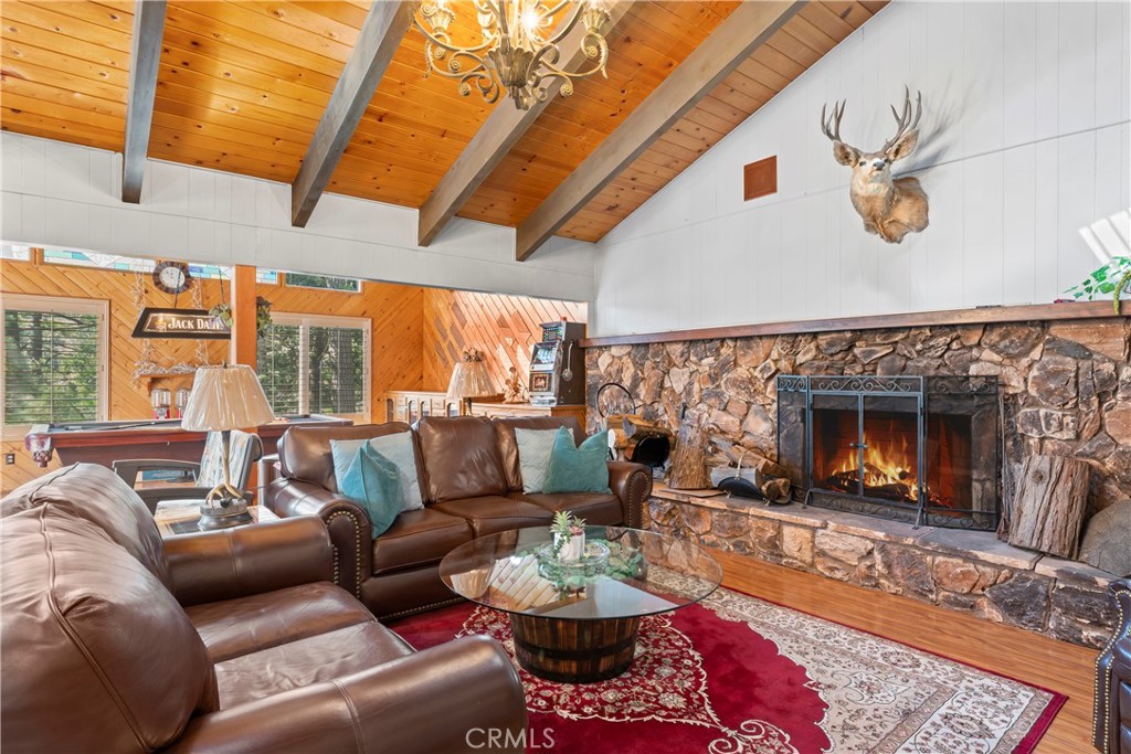 Sprawling, ground-level entry featuring a circular driveway with ample parking for up to 6 cars! This cozy floor plan includes a welcoming living room with a fireplace, a family room with a pool table, a formal dining room, and two spacious bedrooms with a shared bathroom.
The downstairs area includes 4 additional bedrooms, highlighted by a massive primary bedroom with its own fireplace. Two more bathrooms and a storage workshop off the lower level.
Recent upgrades include a new water heater, furnace, granite countertops, stainless steel appliances, hardwood flooring, reinforced decking, retaining walls, new drainage, irrigation, and fresh cement walkways in the backyard. This home is Truly a must-see!
