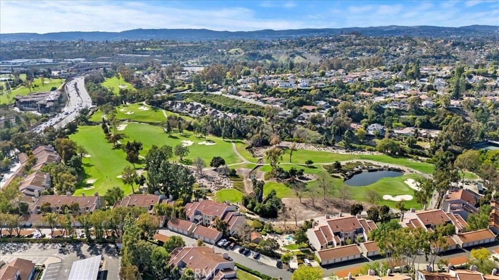 Located in the desirable Baja Finisterra community of Mission Viejo, this charming condominium offers 2 bedrooms and 2 bathrooms, with beautiful views of the golf course. Featuring a spacious, sunken living room with large windows that allow for plenty of natural light, creating a bright and airy atmosphere. The room also includes a cozy gas fireplace, hardwood floors, and recessed lighting, adding to the home's inviting ambiance. The kitchen is well-equipped with appliances, ample storage, and generous counter space, making it perfect for cooking and entertaining. The master bedroom is a true retreat, featuring a large sliding mirrored closet and an en-suite bathroom with dual vanities, and a spacious walk-in shower. The second bedroom is equally spacious, offering plenty of room for family or guests. Additional amenities in the home include updated windows, a newer furnace, a newer air conditioning unit, and fresh paint throughout, ensuring both comfort and energy efficiency. The home also comes with a one-car detached garage that includes extra storage space. As part of the community, residents can enjoy access to a spa/hot tub for relaxation and unwinding. The location is incredibly convenient, with proximity to major freeways, shopping centers, restaurants, the scenic Lake Mission Viejo, the Oso Creek Trail, and highly rated schools. This well-maintained condominium is an ideal choice for those looking for a low-maintenance home with great community amenities and a prime location.