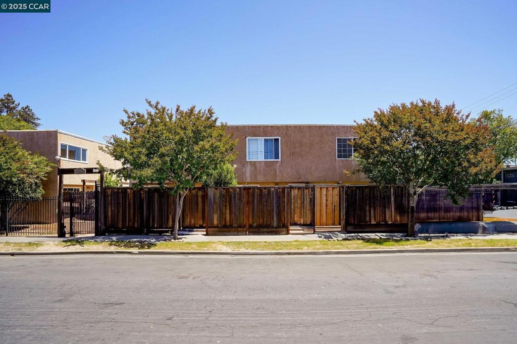 Conveniently Located Townhome-Style Condo with Private Patio and Community Pool – Ideal for Living or Investing. This updated 2-bedroom, 1-bath townhome-style condo is nestled in the Pine Manor community—an intimate enclave of just 16 homes. Ideally situated in central Concord, you’re only minutes from Todos Santos Plaza, BART, dining, shopping, and major highways, offering a lifestyle of convenience and connectivity. This light-filled, move-in-ready home features new flooring and a modernized bathroom. The kitchen includes a gas range, dishwasher, stainless steel refrigerator, and ample cabinetry, with a dedicated dining area just off to the side—great for everyday meals or casual gatherings. The spacious living room opens through sliding glass doors to your private, fenced front patio—perfect for relaxing outdoors, adding potted plants, or enjoying a quiet meal outside. Upstairs, two generously sized bedrooms provide comfortable retreats, with one offering a pleasant view of the community pool. A skylight in the hallway fills the space with natural light. Residents also enjoy access to a sparkling pool and convenient on-site laundry facilities. Whether you're looking for a place to call home or a smart investment, this thoughtfully updated property is ready for its next chapter