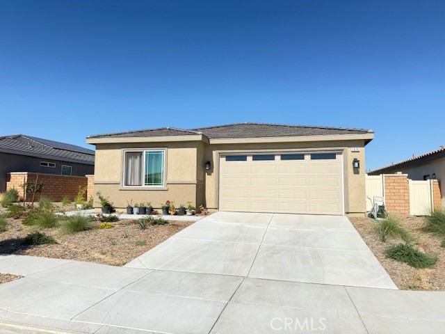 Brand new model home, seller occupied only one month in the desirable community of Spring Mountain Ranch. Huge lot, fantastic for summer barbecues and family gatherings. This home offers an open floorplan, with a spacious kitchen that overlooks the great room. wood floor, Whirlpool stainless steel appliances, including over-the-range microwave with hood, dishwasher, and electric range. Energy-efficient features include Generation lighting LED fixtures, Moen WaterSense faucets and shower heads, a hybrid-electric water heater, and SunPower solar energy system (solar paid off) that may help reduce monthly utility bills. Close to UC Riverside and Loma Linda Medical Hospital. Park located across the street. Don't miss out!
