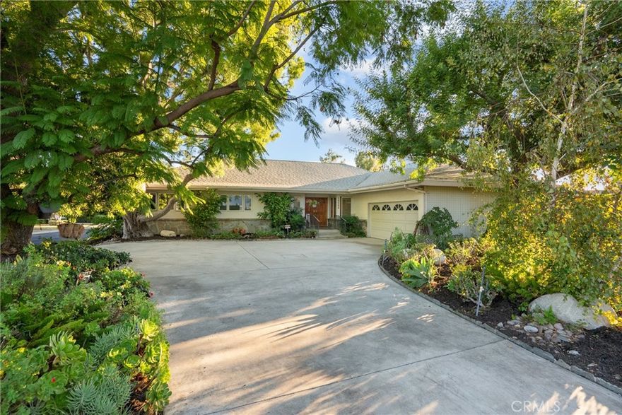 Welcome to 19200 Ballinger Street, a classic California residence tucked within the prestigious Château Highlands neighborhood. Lovingly cared for by the same family for more than six decades, this timeless property rests on a beautifully landscaped 17,500 sq ft corner lot framed by mature trees and lush gardens — offering both privacy and an enduring sense of warmth.Inside, you’ll find five generously sized bedrooms and three tastefully updated bathrooms, blending modern comfort with mid-century charm. The remodeled kitchen features custom cabinetry, granite countertops, and updated  stainless steel appliances — a perfect gathering spot that opens to the inviting dining and living spaces. The updated baths provide a fresh, spa-like experience with elegant finishes and thoughtful design.The spacious living room with its cozy fireplace and custom built in shelves, creates a natural flow between the indoors and the serene outdoor setting.Primary suite is generous in size with a great view of the rear yard and patio deck, stunning large updated bathroom with separate bath and oversized shower, bidet and toilet. Elegant and nicely planned.  Step outside to your private resort-style retreat — complete with a solar thermal-heated, covered pool and electric safety cover, ideal for swimming year-round. The expansive backyard also offers a pickleball/sport court, garden areas, and multiple patios for relaxing, entertaining, or enjoying the sunshine in peaceful seclusion. Additional highlights include a circular driveway, ample parking, and fantastic curb appeal that perfectly complements the charm and character of this distinguished neighborhood. Numerous upgrades include fully paid for solar system this helps keep the utilities affordable, Solar Thermal system to heat the pool water, sub water meter, Roof 2017, new HVAC ( one of the 2 units), copper pipes, lush drought tolerant landscaping and three nearby cul de sacs and more. 19200 Ballinger Street represents a rare opportunity to own a true legacy property in one of the Valley’s most desirable enclaves — where comfort, character, and location unite to create a place you’ll love calling home.