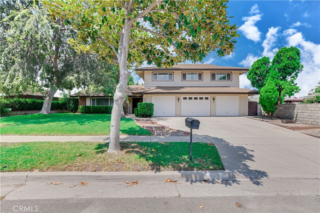 Welcome to this spacious 4-bedroom, 3-bathroom home in the Kellogg Park area of Corona. Offering approximately 2,886 square feet of living space, this property features a comfortable floor plan with both formal and casual living areas, including a huge living room and direct access to the backyard from multiple parts of the house. The main level also includes a functional kitchen that connects easily to the family room, as well as an indoor laundry/mud room with extra storage and its own access to the backyard. Upstairs, the primary suite offers a large walk-in closet and an oversized vanity with generous storage. Three additional bedrooms are located on the upper level, including a second full bathroom with a dual-sink vanity.
Out back, a sparkling swimming pool takes center stage, surrounded by a generous patio area ideal for relaxing or hosting friends and family. With its 8,276 square foot lot, there’s plenty of space for outdoor dining, gardening, or simply enjoying the sunshine. A 3-car garage provides ample room for vehicles, tools, or hobby space. Located near Kellogg Park and within easy reach of shopping, dining, and freeway access to the 91 and I-15, this home combines comfortable living space with a great location, making it a solid choice for those looking to enjoy the Corona lifestyle.