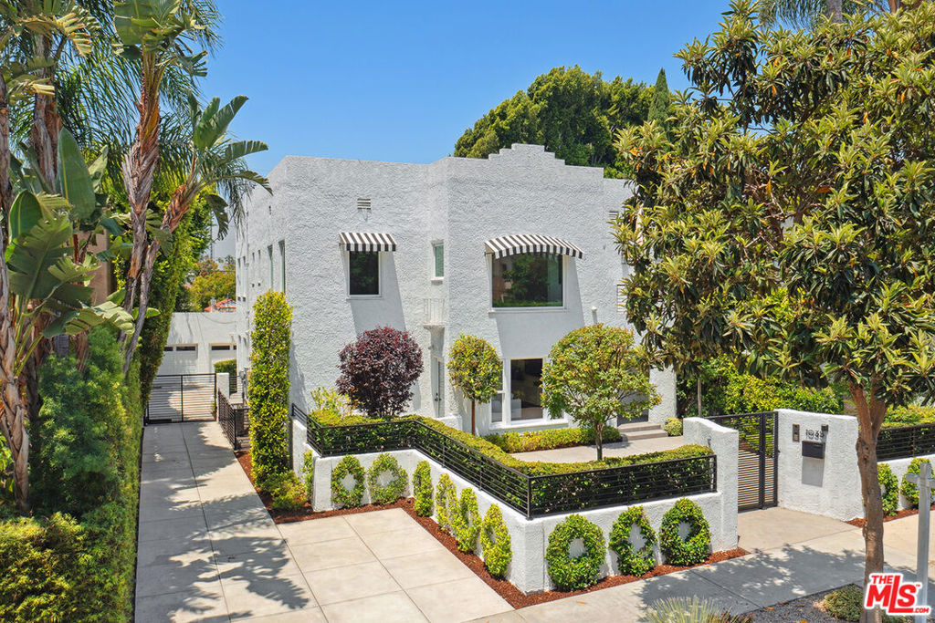 Welcome to 1033 N La Jolla Avenue in the heart of West Hollywood. This meticulously renovated Spanish-style triplex offers a combination of contemporary luxury and income potential of approximately $18,000 per month. The spacious downstairs unit features 3 bedrooms and 2 bathrooms, the upstairs unit is an oversized 2 bedrooms and 2 bathrooms, and a studio apartment tucked in the rear offers full privacy and flexible use ideal for additional rental income, guest quarters, or an office. This home features brand-new flooring, windows, recessed lighting, roof, HVAC, plumbing, electrical, kitchen appliances, and sleek modern finishes. Outside, a detached 3-car garage provides abundant parking and is equipped with 2 EV charging outlets, complemented by ample off-street and additional parking in the driveway for up to 6 cars. This turnkey property, completely remodeled in 2021, blends historic charm with thoughtful modernization, making it perfect for an owner/user, investor, or hybrid. This owner-occupied property will be delivered fully vacant.