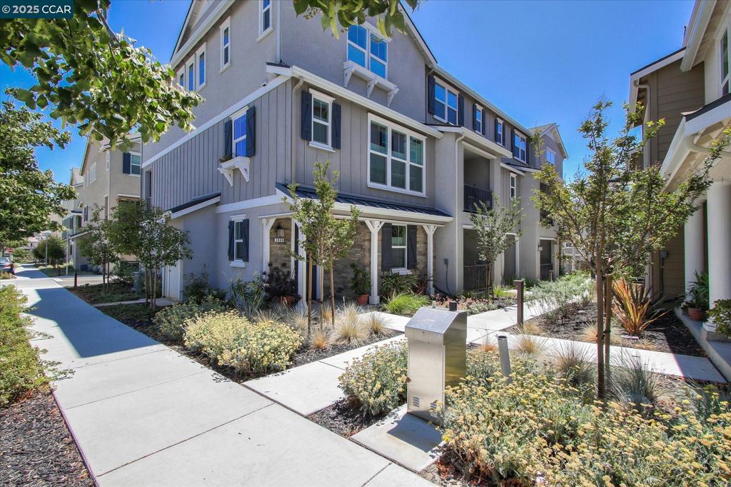 Super Motivated Sellers!! Step into 3988 Windsor Way—an exceptional 4-bedroom, 3.5-bath end-unit townhouse-style condo nestled in the highly sought-after Wallis Ranch community. Spanning 2,160 sq ft, this stylish and spacious residence showcases 9’ ceilings, 8’ interior doors, and a bright, airy layout throughout. The chef’s kitchen is a dream, featuring stainless steel appliances, double ovens, a 36” gas cooktop, granite countertops, walk-in pantry, raised panel cabinetry, and a large granite island with seating for five or more. The open-concept living area connects effortlessly to a private deck, creating the perfect spot for entertaining or unwinding. Upstairs, the serene primary suite boasts a spa-inspired bathroom and generous walk-in closet. Downstairs, you’ll find a rare ADA-compliant bedroom and full bath—ideal for multi-gen living, visiting guests, or a home office. Modern comforts include dual-zone WiFi-enabled HVAC, a whole-house fresh air fan, tankless water heater, recessed lighting, and an epoxied 2-car garage prepped for EV charging. Enjoy access to resort-style amenities including a pool, spa, 24-hour fitness center, and community events at the Kindred House. Explore nearby trails, playgrounds, and a future 8+ acre park with courts and a dog park.