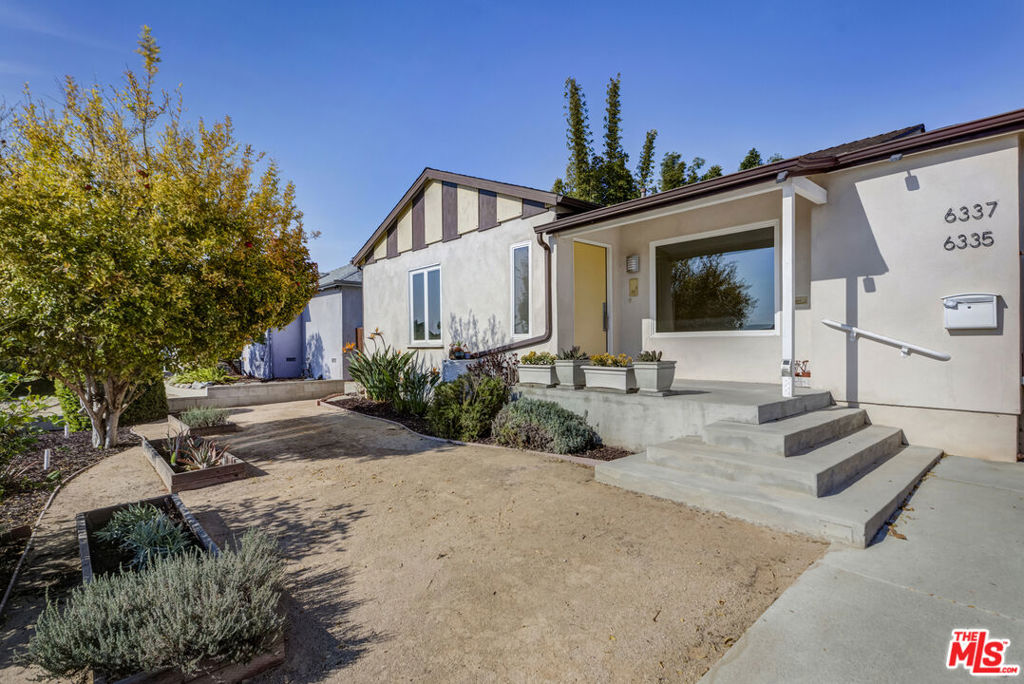 Wonderful opportunity to live in the lovely Kentwood neighborhood of Westchester! Recently remodeled and perched above the street, this home exudes California charm with its original hardwood floors throughout, picture windows, and bright, sunny rooms. The newer kitchen features a vintage Gaffers & Sattler double oven, side by side fridge, and loads of pantry storage. The primary bedroom is ample and boasts a large closet with custom built-ins, sliding doors to the expansive outdoor deck, and a large ensuite bath with a rain shower and double vanity. Two other well-sized bedrooms and bathroom w/ laundry round out the enviable floor plan. Head outside and whip up a farm-to-table meal from the numerous fruit trees on the property such as pomegranate and lemon along with multiple raised beds growing tomatoes, herbs, squash, and grapes. Love entertaining houseguests or need a separate space to work from home? The newly permitted, detached ADU with separate address in the backyard features a kitchen w/ dishwasher and separate laundry, bathroom, AC, and a lofted office. Minutes to LMU, Playa Del Rey, Playa Vista, LAX, and some wonderful local schools make this the perfect spot to put down roots and stay awhile!