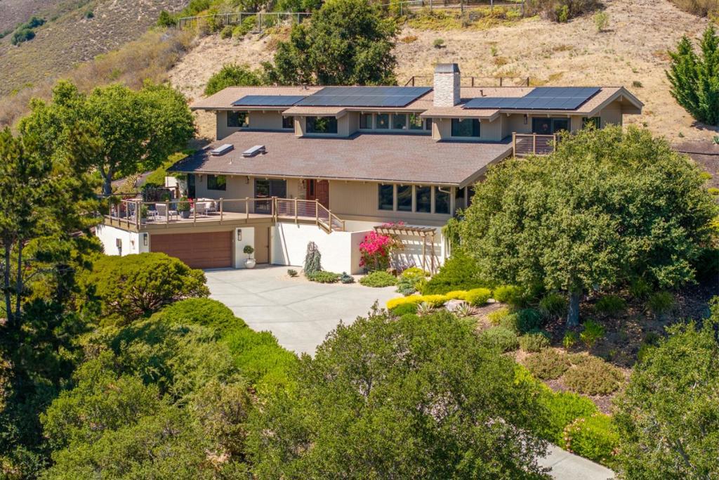 Photos simply can't capture these views. This property is a must see to appreciate! Extraordinary remodel with quality craftsmanship and attention to every detail. Bold views from every room, grand custom door entry. Vaulted ceilings, stone and wood flooring, and plaster walls throughout. Quartzite kitchen and baths, custom cabinetry, porcelain kitchen sink, Wolf gas cooktop. Living room with custom mantle and gas fireplace. Primary bedroom with ensuite double vanity bathroom, soaking tub, walk-in shower, blackout shades and private balcony. Custom window treatments throughout with motorized solar shades. Breakfast room with views to the coast. Upstairs family room. Oversized laundry room. Three zone heating and AC with filtration system. Mature landscaping with lavender, bougainvillea and olive trees. Lutron remote landscape lighting system, stone patios and pathways. Stunning vistas from patios and decks. Gated Firewise Community close to restaurants and wine tasting in CV Village. 2-car garage with 2 EV chargers, solar system, CUSD. Sophistication, tranquility and sunshine in Carmel Valley!