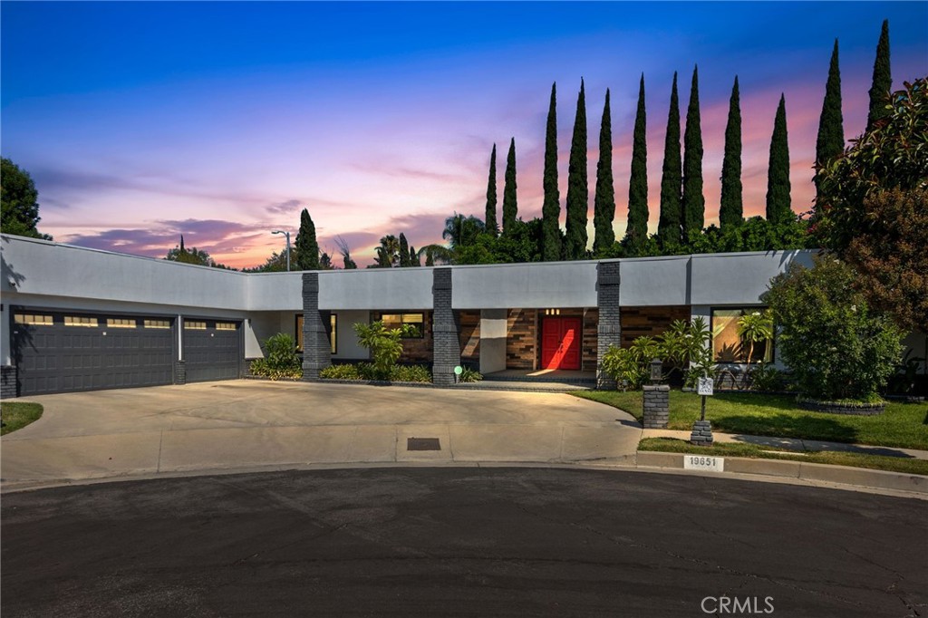 Welcome to 19651 Marilla Rd, a stunning single-story retreat tucked away in Northridge’s coveted Devonshire Highlands. This 4 bedroom, 4 bath home spans nearly 2,800 sq ft and has been thoughtfully updated to combine modern style with everyday comfort. A formal double-door entry opens to a bright step-down living room with soaring ceilings and a fireplace, while the chef’s kitchen features quartz counters, custom cabinetry, stainless steel appliances, and an effortless flow into the family room. Accordion glass doors extend the living space outdoors, creating seamless indoor-outdoor entertaining.
The primary suite is a private sanctuary with a walk-in closet and spa-inspired bath complete with oversized shower and soaking tub. Secondary bedrooms offer flexibility for guests, a home office, or multi-generational living. Step outside to a peaceful backyard designed for entertaining with a spacious deck, covered patio, and contemporary landscaping that invite both gatherings and quiet relaxation. Recent system updates add confidence and ease, allowing you to simply move in and enjoy the lifestyle this home delivers on a tranquil cul-de-sac close to shops, dining, and schools.