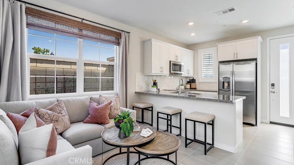 NEW CONSTRUCTION! This new two-story home boasts a modern and spacious design. The first floor is host to an inviting open-concept layout where the kitchen, living room and dining room meet. Both bedrooms are located on the second floor, including a lavish owner’s suite at the back of the home featuring a full bathroom.
Vibe is a new series of single-family homes now selling in the Nuvo Parkside masterplan in Ontario, CA. The gated masterplan offers onsite amenities, including a modern clubhouse and BBQ area. A future Great Park and Sports Arena are planned to be built near the community. Ontario Mills Mall is home to a variety of shopping and dining options, and residents can catch a live performance from a hit artist at the Toyota Arena. Plus, the Ontario Airport is a short drive away.