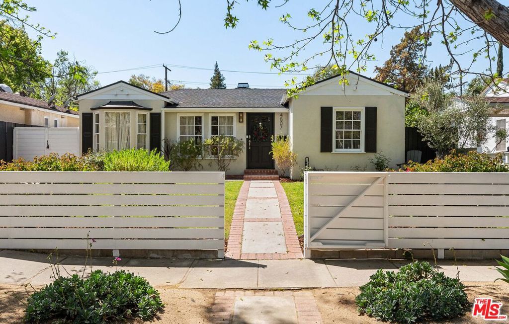 Welcome to 4507 Van Noord where timeless elegance meets the vibrant energy of Studio City.Perfectly situated in the very heart of one of LA's most coveted neighborhoods, this exquisitely renovated 4-bedroom, 3-bathroom single-level residence blends refined design with everyday comfort. Tucked away on a peaceful, tree-lined street, you're just moments from the iconic Sportsmen's Lodge, top-tier dining, trendy boutiques, and everything Ventura Boulevard has to offer.Step inside to discover a sun-soaked open floor plan, where oak floors, soaring vaulted ceilings, and custom cabinetry set a tone of warm sophistication. The formal dining area is ideal for entertaining, while the chef's kitchen is a true showstopper featuring marble countertops, a chic tile backsplash, high-end stainless steel appliances, and handcrafted cabinetry that effortlessly merges style with function.The serene primary suite offers a peaceful escape with vaulted ceilings, a dramatic shiplap accent wall, a spacious walk-in closet, and a spa-like ensuite bath complete with soaking tub, dual marble vanities, and designer finishes. Two additional bedrooms and a beautifully appointed bathroom are thoughtfully positioned, offering comfort and privacy.A detached guest house adds versatility ideal as a fourth bedroom, private office, or luxe guest retreat. Outside, the backyard transforms into a private resort. Lounge by the sparkling pool and spa, entertain at the built-in BBQ, or relax under the pergola. With low-maintenance turf and an expansive brick patio, this outdoor space is both stunning and practical.Experience the best of Studio City living modern luxury, ultimate convenience, and a location that truly can't be beat.