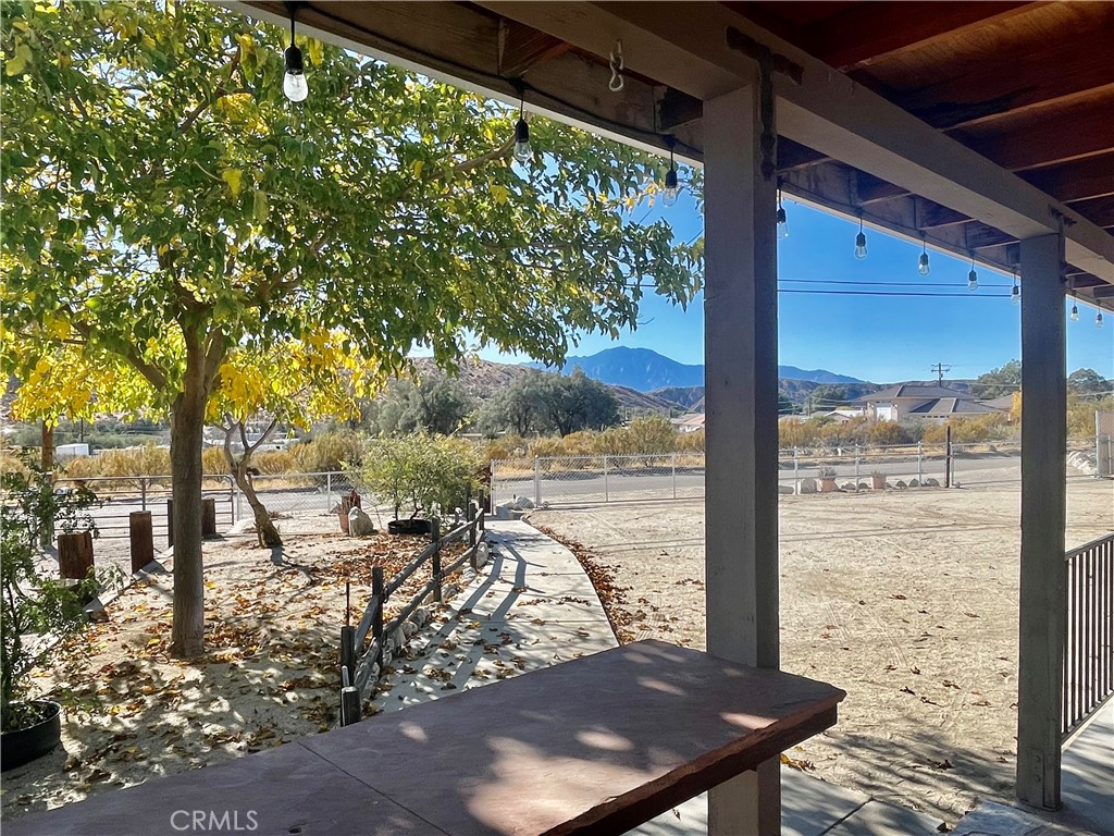 ***Sellers will carry!***
First time on the market - A home with Heart and Heritage. Welcome to a cherished gem, making its debut on the market after a lifetime of creating memories. It's time to pass on the torch.
Situated on an oversized corner lot, the property boasts panoramic views of majestic Mt. San Jacinto, offering a serene escape from the hustle and bustle.
At the heart of the property is an approximately 1,000 sq ft garage/workshop, a dream space ready to meet your creative or practical needs. Whether you're a hobbyist, tinkerer, or need extra storage, this space is as versatile as your imagination.
The home itself features 3 bedrooms, 2 bathrooms, a dedicated laundry room with ample storage, and a flex room perfect for an office or creative studio. The game room has seen many a pool match and is ready for your imagination.
The oversized covered front porch, complete with water and power, sets the stage for family gatherings, barbecues, and celebrations under the open sky.
Located on a paved road in the highly desirable southwest end of the valley, this home offers unbeatable convenience. Just a short walk brings you to the farmers market, local eateries, parks, a bird sanctuary, and the nearby elementary school. For outdoor enthusiasts and explorers, Joshua Tree National Park, Pioneertown, and Palm Springs International Airport are all within a 20-minute drive.
Don't miss the chance to own a home with character, square footage, and location — where every sunset over the mountain is a reminder that you’ve found something truly special. Here is the finale - the seller has had the property recently appraised and is offering it below appraised value, giving you an immediate equity advantage. Solar is in place setting you up for significant savings and energy independence. The potential is limitless.