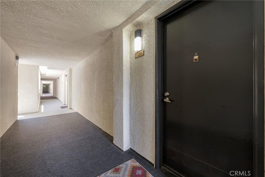 Photo of 21450 Burbank Boulevard #203, Woodland Hills, CA 91367 (MLS # SR25193805)