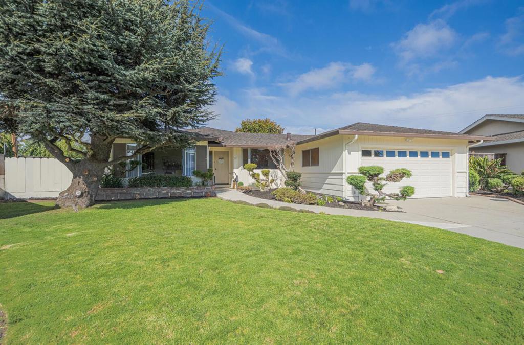 Welcome to the desirable Monterey Park neighborhood of South Salinas. Custom Built in 1964, this rare gem of a home is now offered for sale by the original family. Just a short stroll to Salinas Valley Hospital & situated on a beautifully landscaped, oversized lot this lovely property boasts privacy, verdant lawns, mature fruit trees, flowering shrubs & two side yards with ample space for a greenhouse, pool or studio office. With 1,559 sq ft of well-planned living space, the 3 bed 2 bath residence offers a warm & inviting atmosphere, ample storage & a newer roof. The updated kitchen is equipped with top-of the line SS appliances, custom cabinets, granite counters & a rolling island that offers additional prep & storage space. Open to both the dining area & the cozy family room & with easy access to the back patio, this kitchen is truly the heart of the home. The elegant living room offers a peaceful, serene retreat & beautiful afternoon light with its large picture window overlooking the front lawn & neighborhood trees. The primary bedroom features double closets & a view across the back garden. 2 additional bedrooms boast hardwood floors. The superb location & the size of the lot (almost 1/4 acre) makes this an exciting find. So many possibilities!
