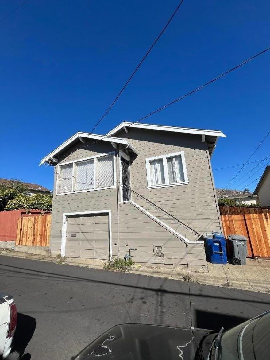 Located in the heart of Old South San Francisco, this rare opportunity features two detached single-family homes on one lot ideal for investors, contractors, flippers, or multi-generational living. Just steps from downtown dining, shopping, and the vibrant business district. The front home at 210 7th Ln. offers 3 bedrooms, 1 bath, approx. 1,200 sq. ft., plus an attached 2-car garage and a spacious garage/basement area with expansion potential. The rear home at 213 Pine Ave. includes 2 bedrooms, 1 bath, a living room, and its own driveway with an attached 1-car garage. Both homes are separately metered for gas and electricity and currently tenant-occupied. A truly unique property with flexible use potential in a sought-after location.