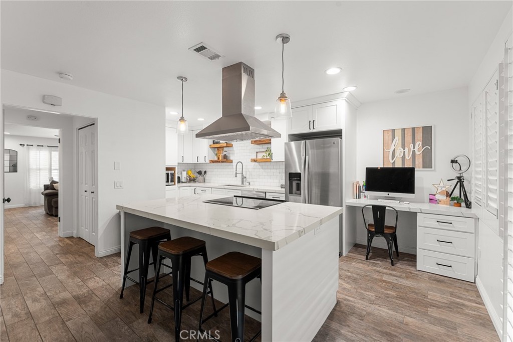 Modern comfort meets classic charm in this beautifully upgraded 2 bed, 1.5 bath condo in the heart of South Redlands. Offering 1,201 sq ft of thoughtfully designed living space, this home features wood-look tile flooring on the main level, cozy carpet in the bedrooms, and plantation shutters throughout. The fully remodeled kitchen shines with quartz countertops, custom cabinetry, a spacious entertainer’s island, upgraded appliances, and sleek LED lighting. Both bathrooms have been tastefully updated, including an upstairs bath redone with a rain showerhead. Stay connected with CAT5e hardwired internet and enjoy the convenience of custom closet systems as well as laundry upstairs. As an added peace of mind, HVAC and Hot water heater were updated for efficiency in 2018 adding to the list of thorough upgrades in this property. The private gated patio opens directly to the well-manicured courtyard with access to the community pool and sauna. Just a short walk to downtown Redlands—enjoy local dining, shopping, and charm at your doorstep.