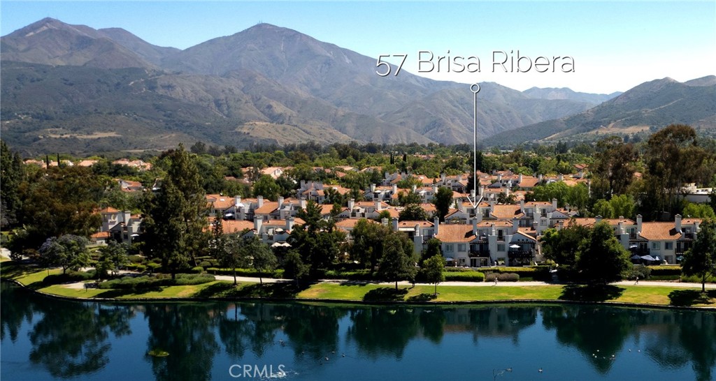 Welcome to your serene ground-level retreat in the lake-front community of Brisa Del Lago. This single-story condo is located just 1 street back from the lake. Step inside to discover a thoughtful 1-bedroom, 1-bath open floorplan with elegantly laid diagonal flooring tiles. The bright living room features a gas fireplace, while the kitchen shines with gleaming granite countertops, garden window, high quality solid wood cabinets, breakfast bar, and ample cabinetry customized to maximize storage space. The spacious bedroom is complete with dual closets and sliding glass doors to your landscaped private patio… perfect for enjoying peaceful mornings or unwinding with an evening beverage. The bathroom hosts dual sinks and jack-n-jill door for guests. The bonus space by the laundry room has been converted to a mini library, lined with bookshelves for the avid reader and collector. This well-maintained property has high-value upgrades such as brand new AC, shiny new dual-pane windows and sliding glass doors, new garage door, new lighting fixtures, new garbage disposal, and fresh interior paint throughout including the garage walls and epoxy-coated floors. Designed for both comfort and convenience, the unit includes inunit laundry, an attached one-car garage with direct access PLUS an additional parking spot. Indulge in resort-style amenities including a community pool and spa with panoramic views of the Lake. Ideally located just 1 block from the highly rated Trabuco Mesa Elementary School and Trabuco Mesa Park’s playground & tennis court. Named the safest city in Ca, Rancho Santa Margarita is also one of the most amenity-rich cities in Orange County. Residents enjoy access to the Beach Club, a splash pad, four Olympic-sized pools, fishing, 13 parks, picnic areas, sports courts, soccer fields, baseball diamonds, tennis courts, multiple playgrounds, and a vast urban trail system. The community hosts various events throughout the year, including spectacular 4th of July fireworks over the lake. Schedule a tour and make Brisa Del Lago your lakeside haven.