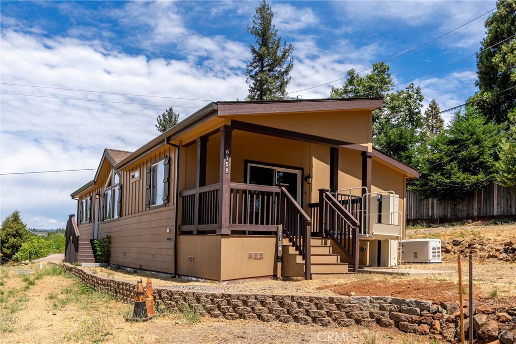 Welcome to this charming manufactured home nestled on its own land in the community of Magalia, with NO HOA dues! This light and bright 2-bedroom, 2-bathroom home also includes a spacious bonus room—perfect for a home office, guest space, or hobby room.
Step inside to an inviting open floor plan with vaulted ceilings, creating a spacious and airy feel. The beautiful kitchen features a central island with a breakfast bar, ample cabinet space, and plenty of natural light—ideal for both daily living and entertaining.
The primary suite includes a large closet, soaking tub, and easy-access shower, offering comfort and convenience. Other highlights include indoor laundry, window blinds throughout, a covered front deck with chair lift for accessibility, and an automatic generator for peace of mind.
Enjoy the large side yard with endless potential—perfect for gardening, outdoor living, or creating your dream yard oasis. With its natural surroundings and move-in ready condition, this home offers the perfect blend of comfort, practicality, and charm.
Don’t miss this opportunity to own a piece of paradise in Magalia! Buyer to verify all aspects of the property they deem important to the sale.