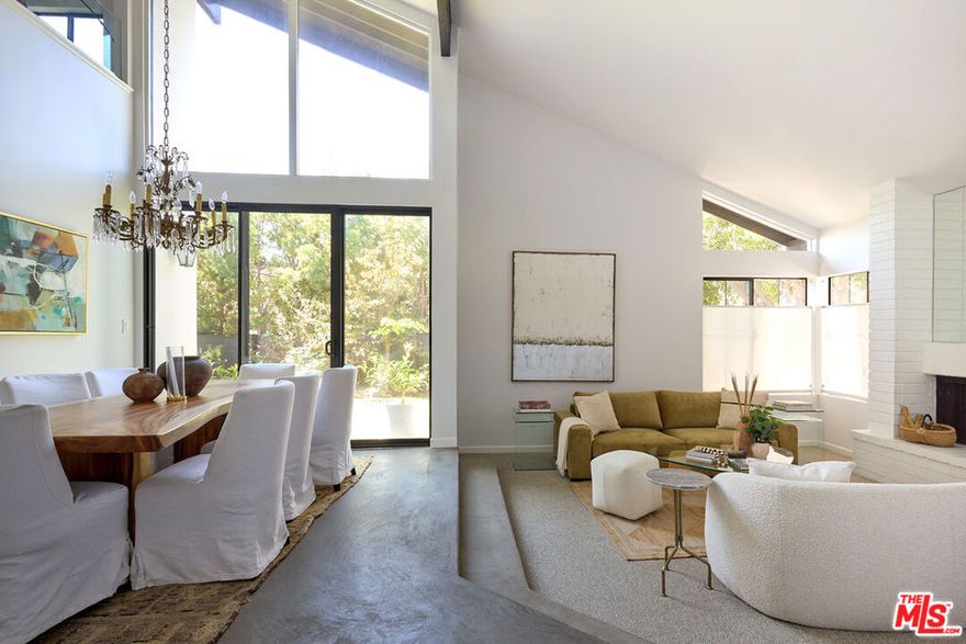 Welcome home to 10862 Garland Drive. If you've been dreaming of a sun-drenched home that perfectly balances style and comfort, your search ends here. This Studio Estates gem sits on a peaceful cul-de-sac, giving you a small-town feel while keeping you connected to everything you love about the big city. From the moment you step inside, you'll fall in love with how the natural light dances through every room: gentle morning rays in the kitchen, and a magical golden hour glow that bathes the front living area. With three comfortable bedrooms, a versatile loft space featuring a clever Murphy bed, and multiple spots designed for gathering with friends and family, this home grows with your lifestyle. The attached two-car garage leads into a stunning double-height living area that immediately makes you feel at home. When you need a quiet moment, slip away to the charming sunroom or step outside to your own private oasis  complete with mature fruit trees and a fire pit perfect for evening conversations under the stars. The location couldn't be better! You can easily access neighborhood favorites while being just minutes from top-rated schools, beautiful parks, and all that downtown Culver City offers. Veterans Park is practically in your backyard, with pickleball courts, tennis, basketball, and a refreshing outdoor pool waiting for you.