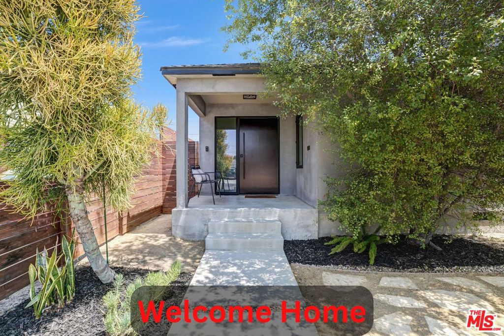 Welcome home to 3558 S. Muirfield Rd. located in historical Crenshaw Manor nestled in West Adams. This home has been exquisitely reinvented to meet your every living and entertainment need to include an oversized open living space, custom kitchen, cabinetry, a 9'x4' island with Brazilian Aquarela stone and backsplash, a six-burner cooktop and range hood, double ovens and a custom bar cabinet. Home has two large suites, both with custom 5-piece baths: dual sinks, walk-in shower and soaking tub. Enter past your new fully landscaped yard thru a custom pivot door. The rear dual glass framed door, and casement windows are by Western. The home has consistent red oak hardwoods throughout, a dedicated laundry room and custom closet cabinetry. The garage is partially finished and has updated electrical. Newer roof (2017), central air and heat, tankless water heater, full electrical rewire and upgraded to 200 amps (with an additional box). The foundation is reinforced and strapped. Book your tour. This one won't last!