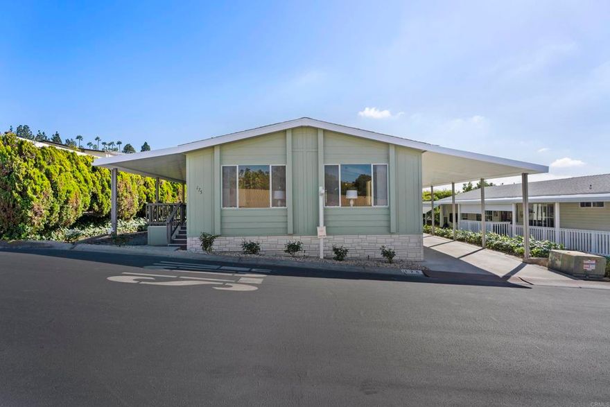 Beautifully updated 2BR/2BA + office/den, 1,344 sq. ft. home in Palomar Estates West 55+ community. Features include wood vinyl throughout, upgraded kitchen with newer appliances, large walk-in closet, fresh paint inside/out, new light fixtures, new front porch, refreshed landscaping, and new carpet on stairs & back porch. Open, light-filled floor plan, 2-car carport, and large storage shed. Resort-style amenities: pool, spa, fitness, pickleball, putting green & more. Prime San Marcos/Carlsbad location with low space rent!